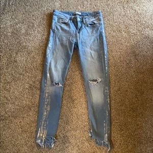 Zara fringe jeans with silver paint detail.